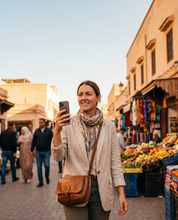 Traveler walking confidently through a market street, protected against pickpockets